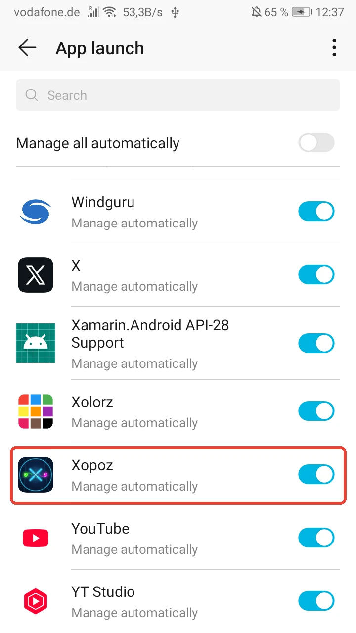 App launch list with the Xopoz row highlighted in red, showing Manage automatically with the switch on