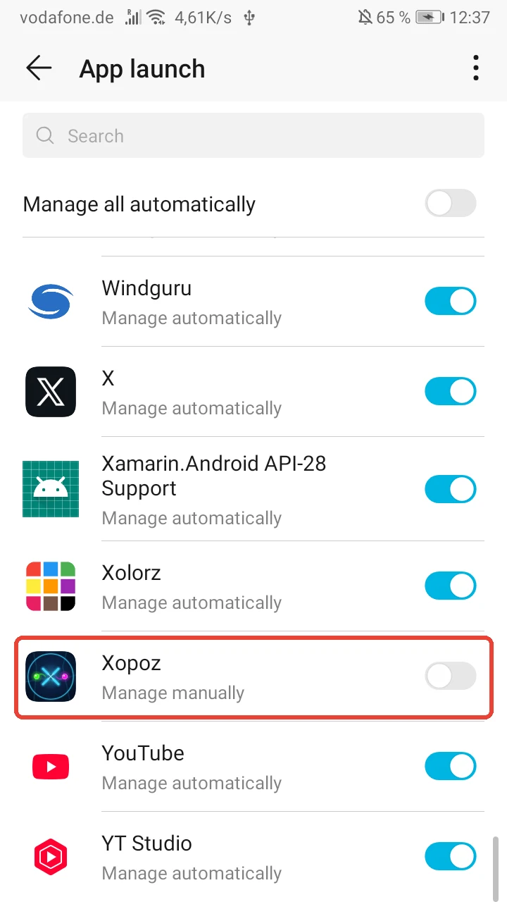 App launch list with the Xopoz row highlighted in red, now showing Manage manually with the switch off